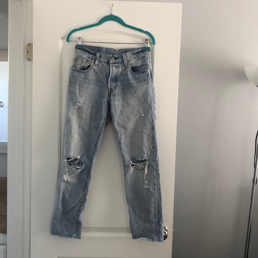 Levi’s 501 distressed blue jeans. Never been worn.